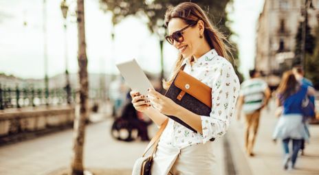 Woman with iPad in the city