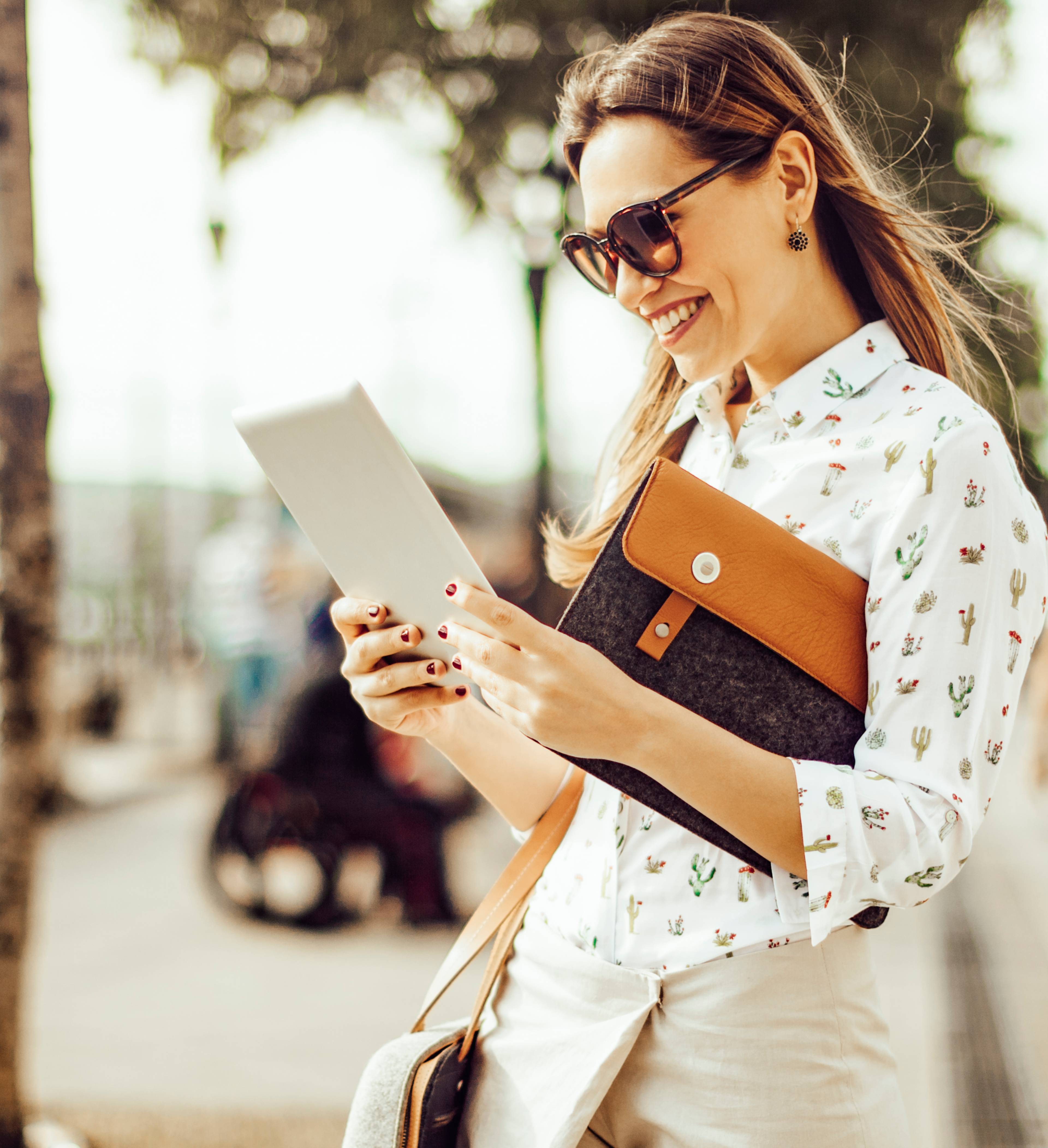 Woman with iPad in the city