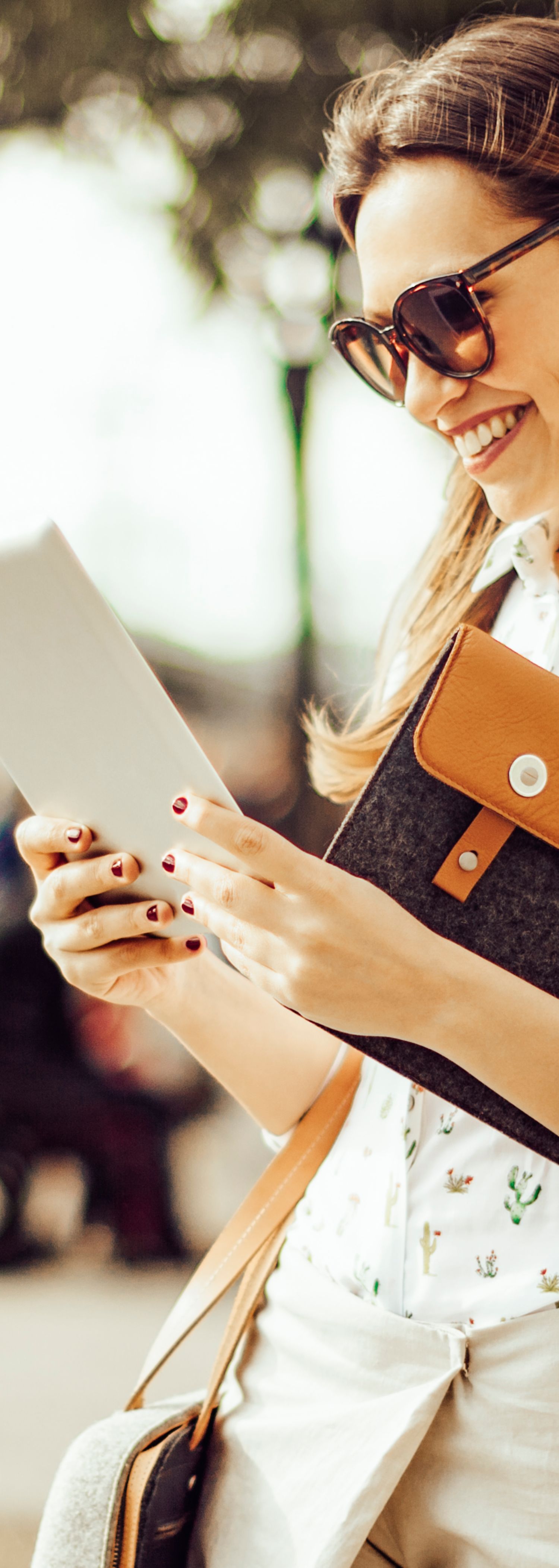 Woman with iPad in the city