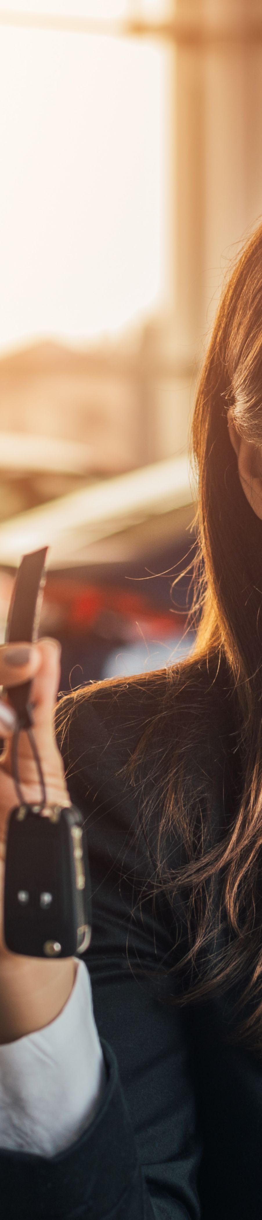 Woman holding car key