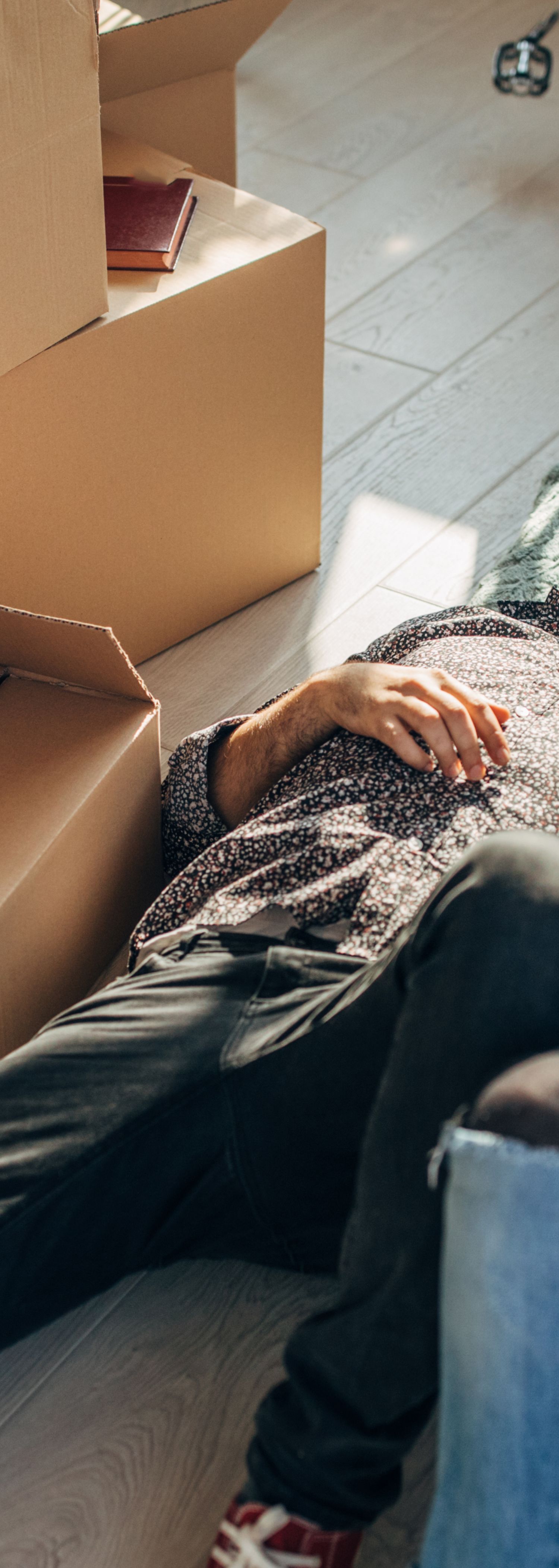 Young couple with moving boxes