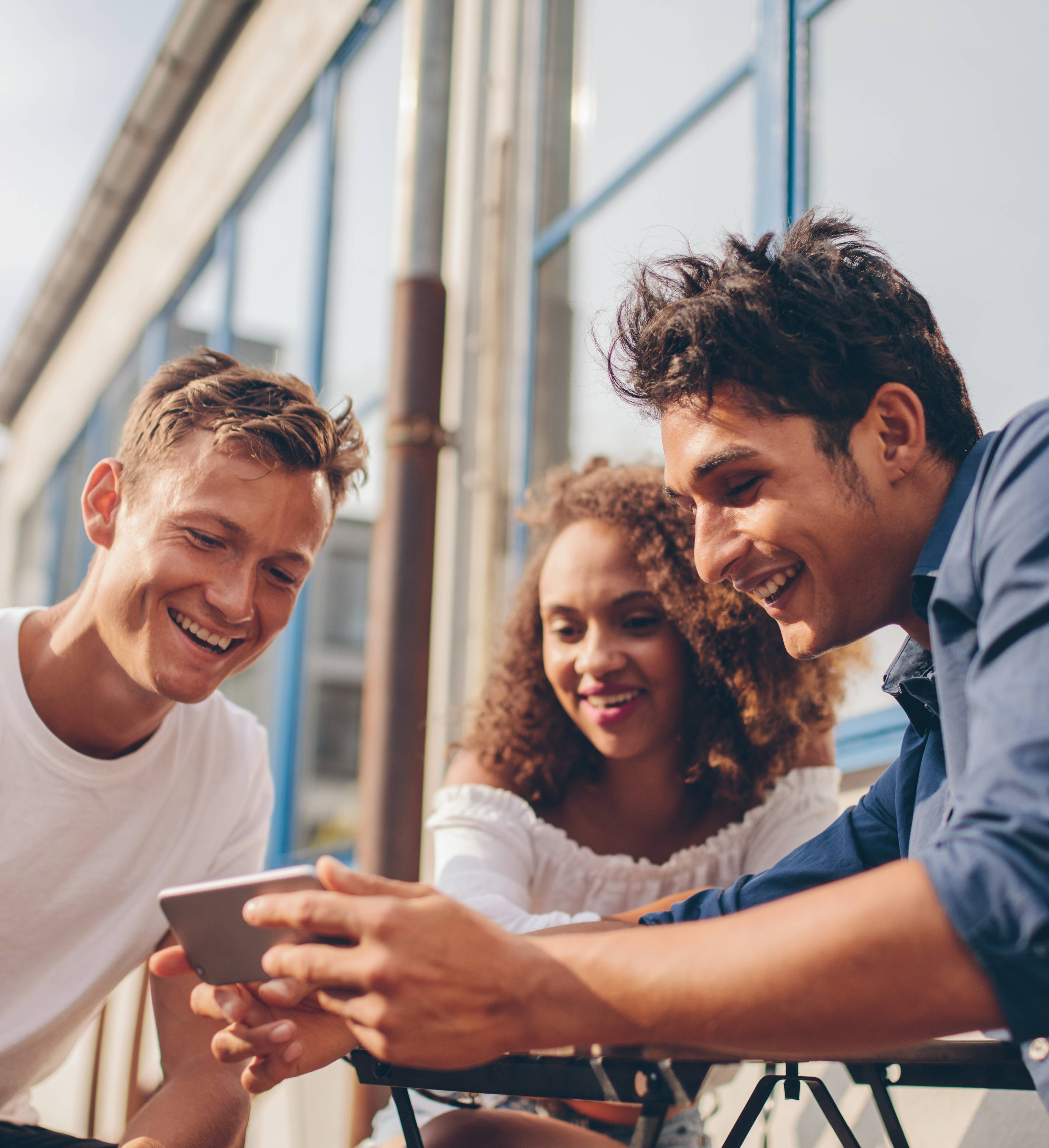 Young people on their mobiles