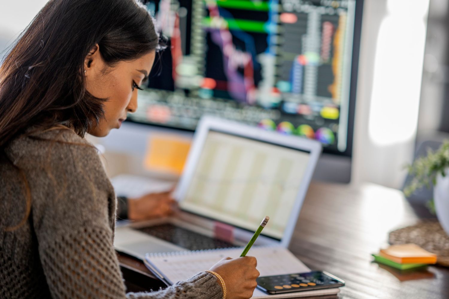 Woman with computer notes