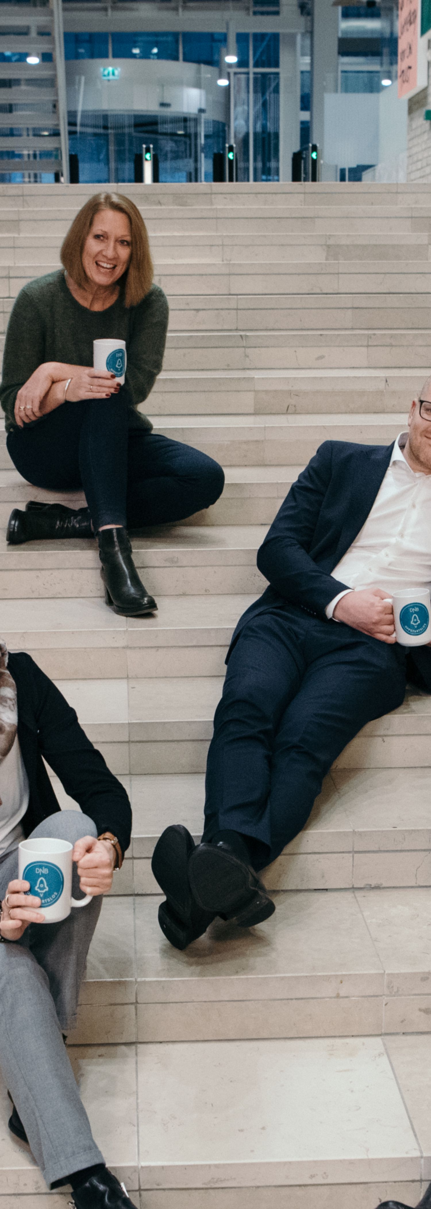 Six start-up advisers sitting on some stairs