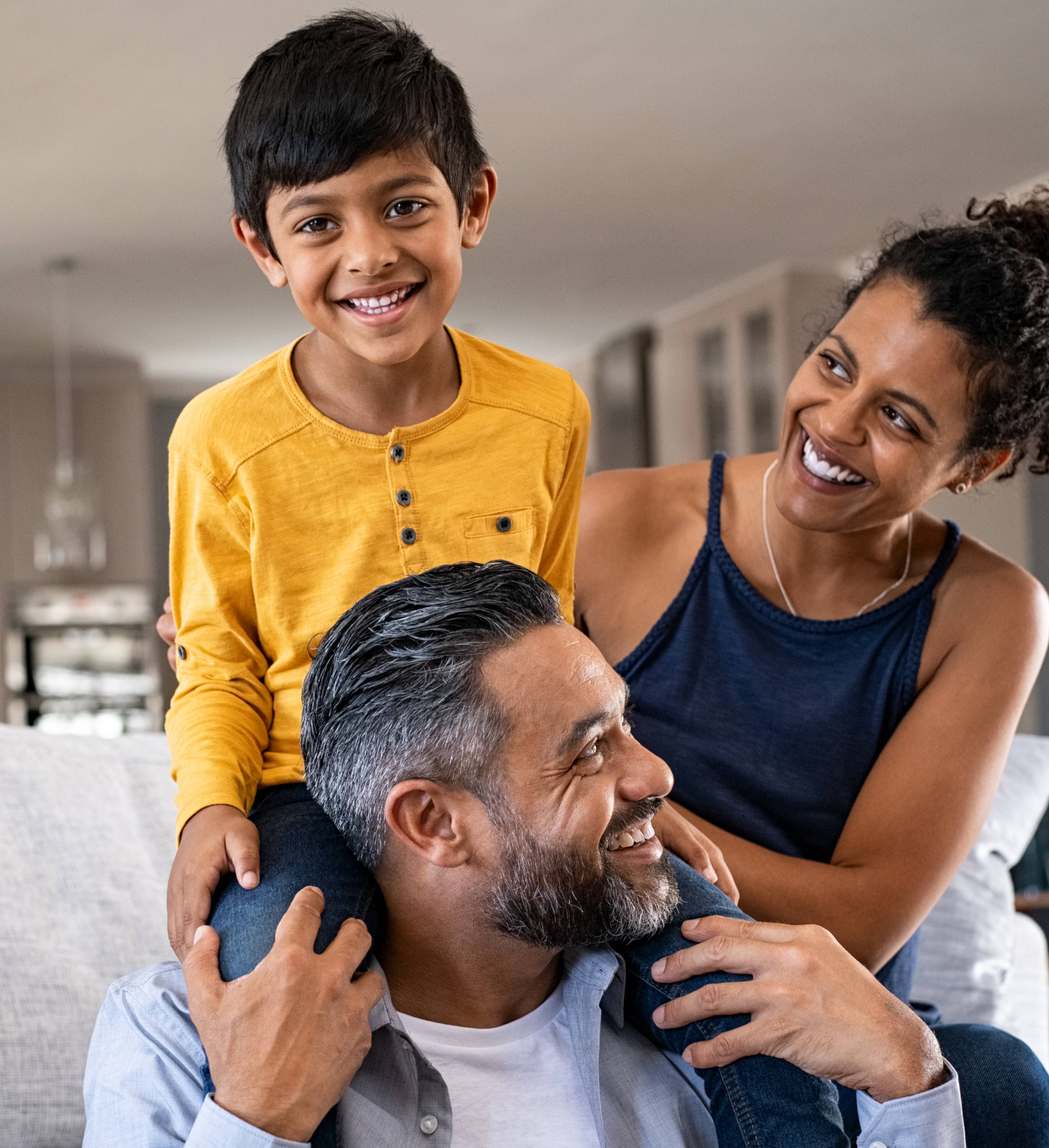 Smiling family at home