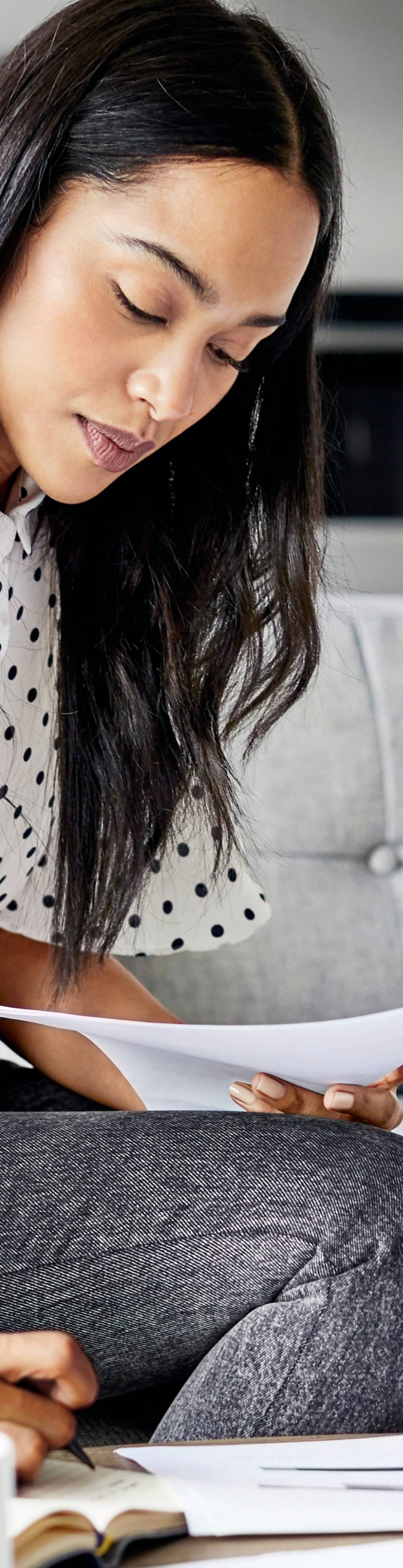 Woman working on a sofa