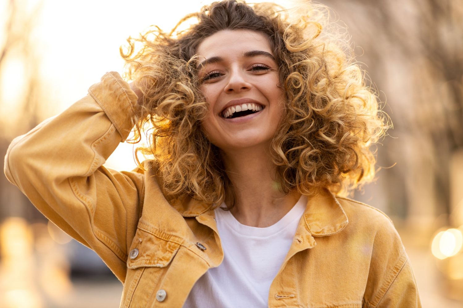 Young smiling woman with curly hair