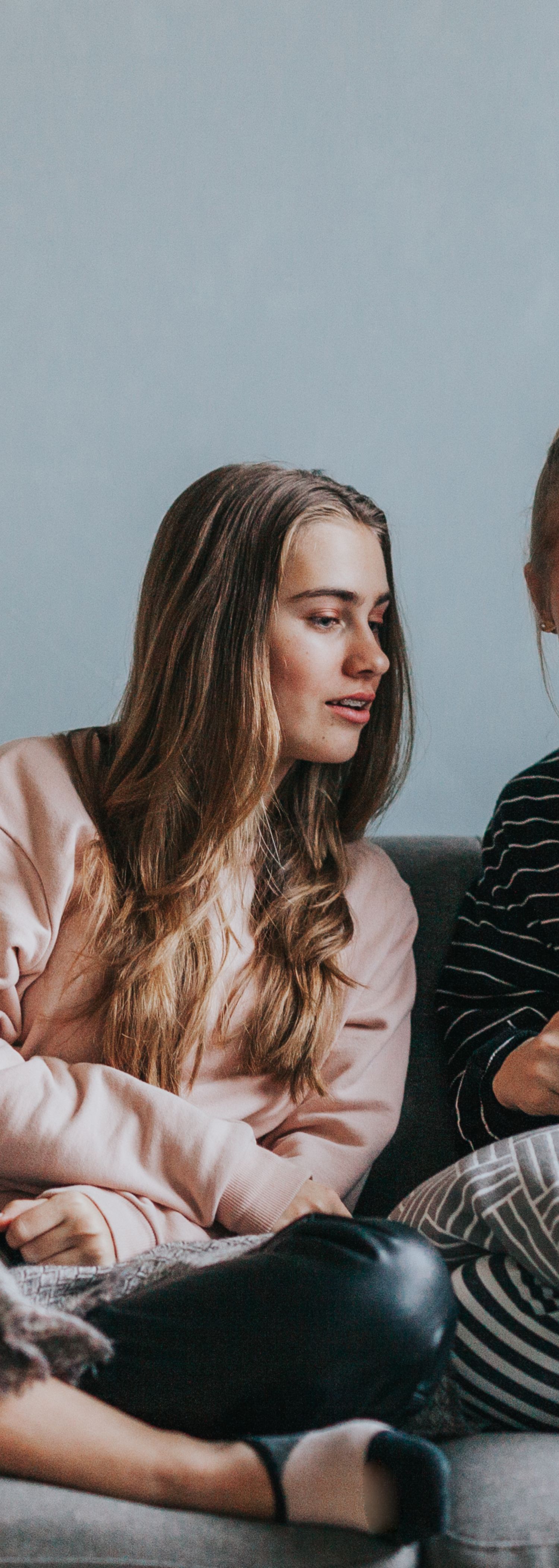 Girls sitting on a sofa