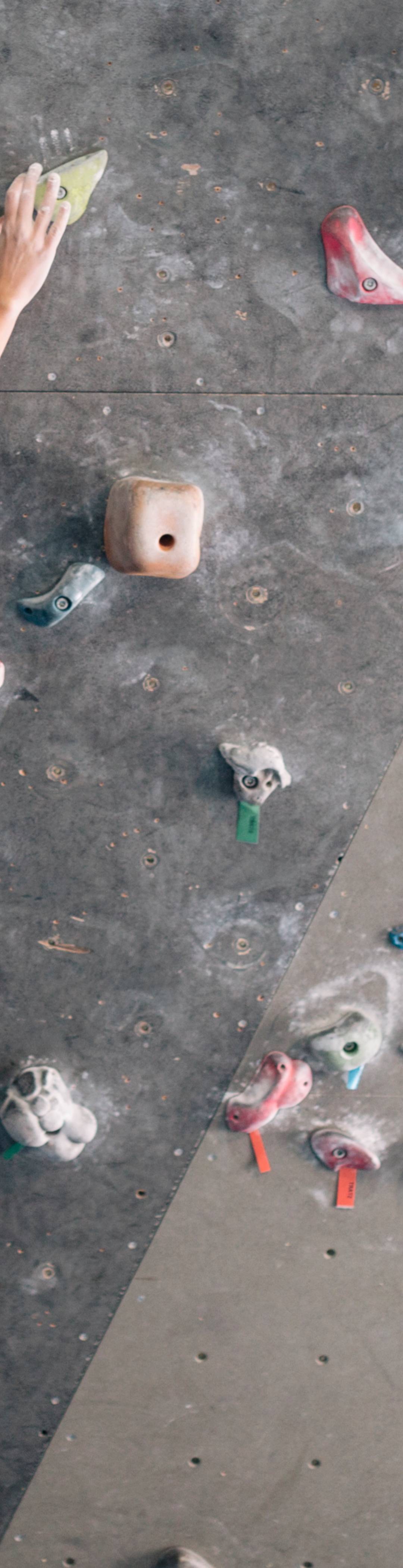 Girl on a climbing wall