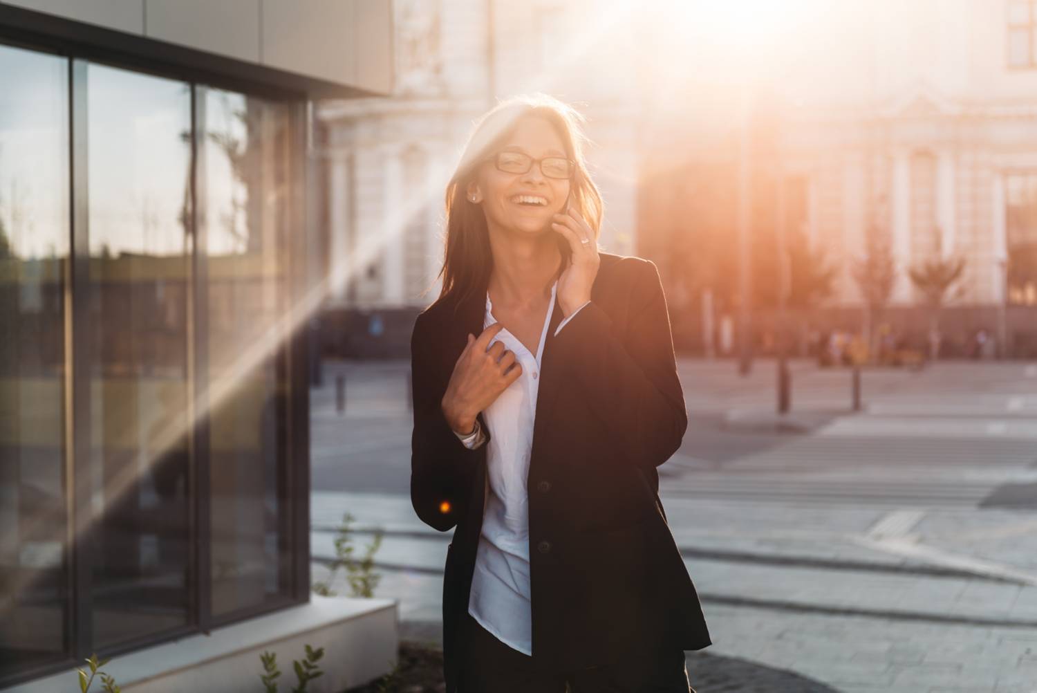 Smiling woman calling on mobile