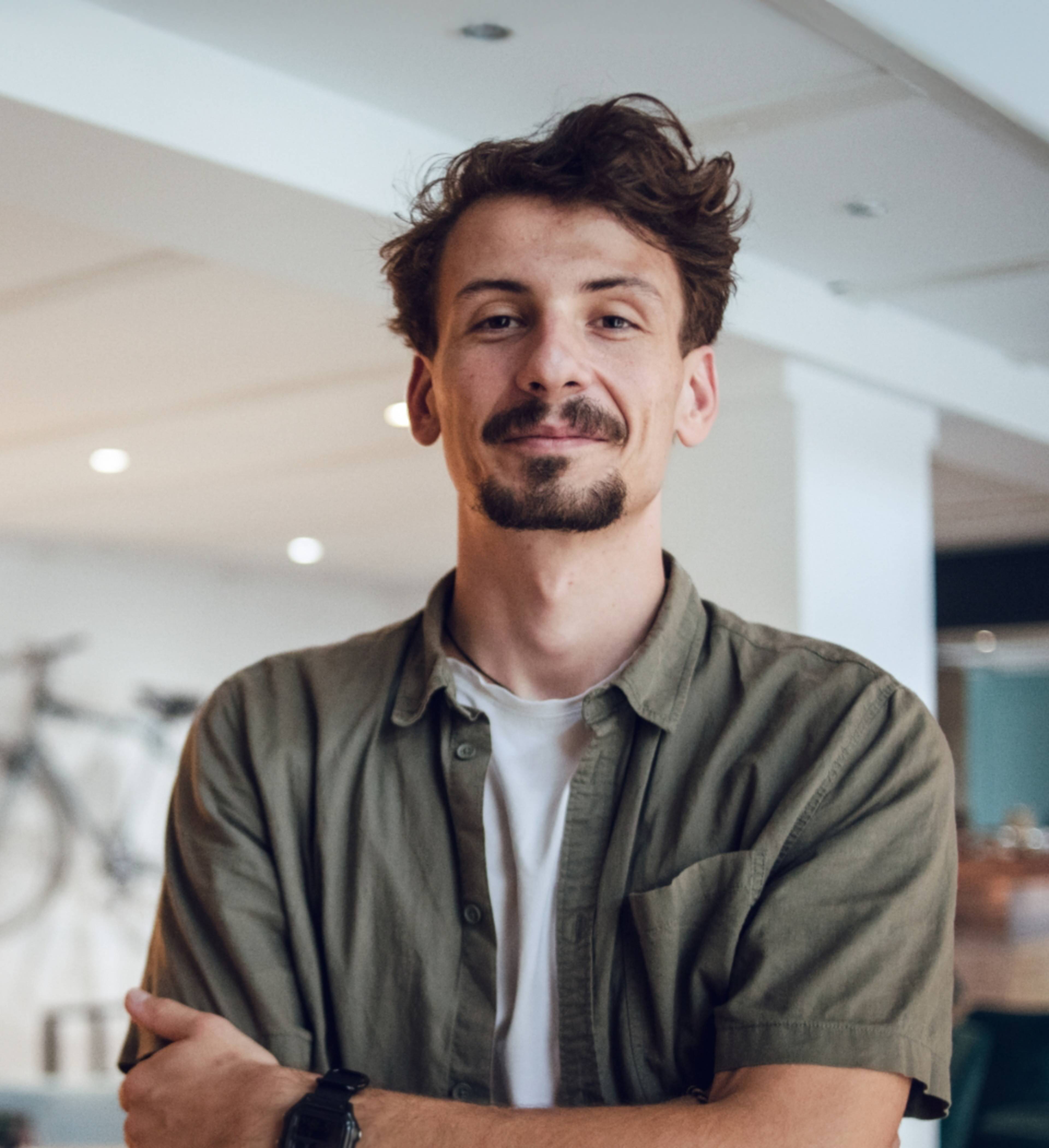 Man with shirt smiling and looking into the camera. Has started a limited company