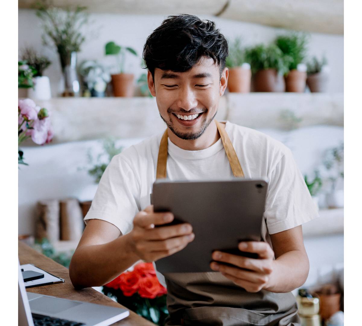 Man with tablet ordering non-life insurance