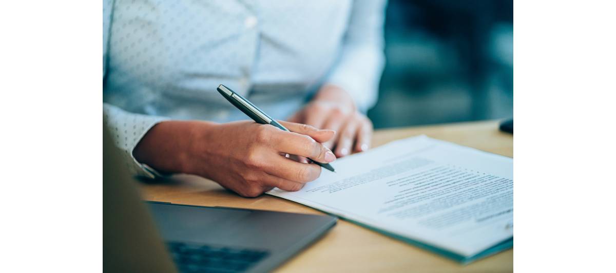 A person signing some documents 